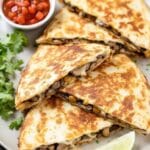 a plate of quesadillas with oaxaca cheese and mushrooms