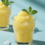 A glass of Frozen Lemonade Slushie with Coconut Water & Mint