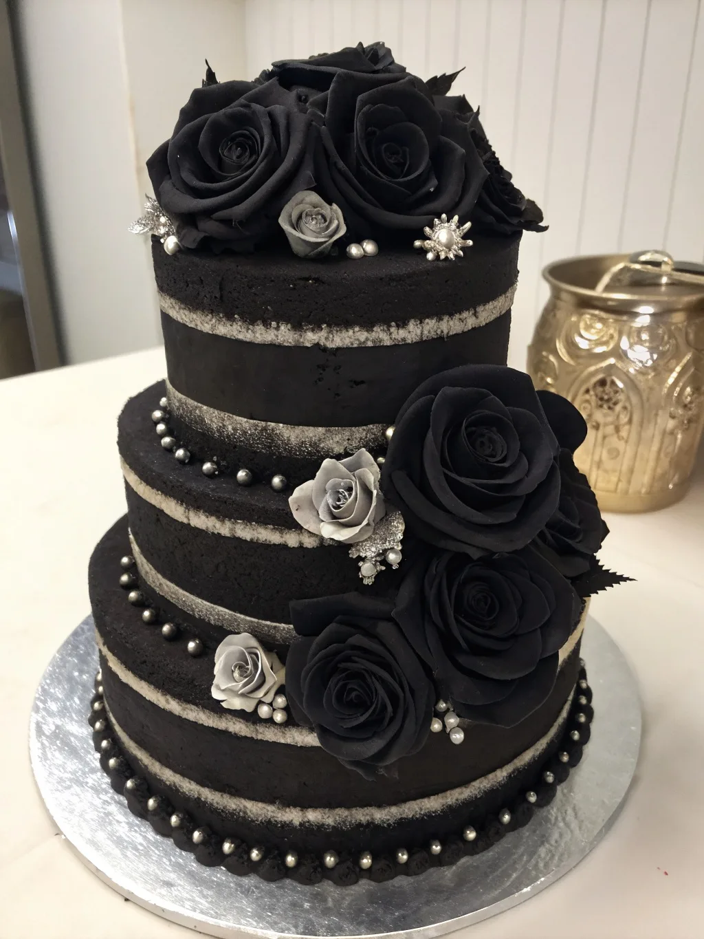 22 Gothic Wuthering Heights Party Recipes (A Moody Literary Menu) 4 A three-tiered Gothic black velvet cake decorated with black and gray roses.